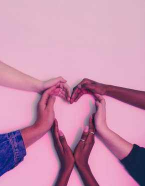 Five people joining hands to form a heart